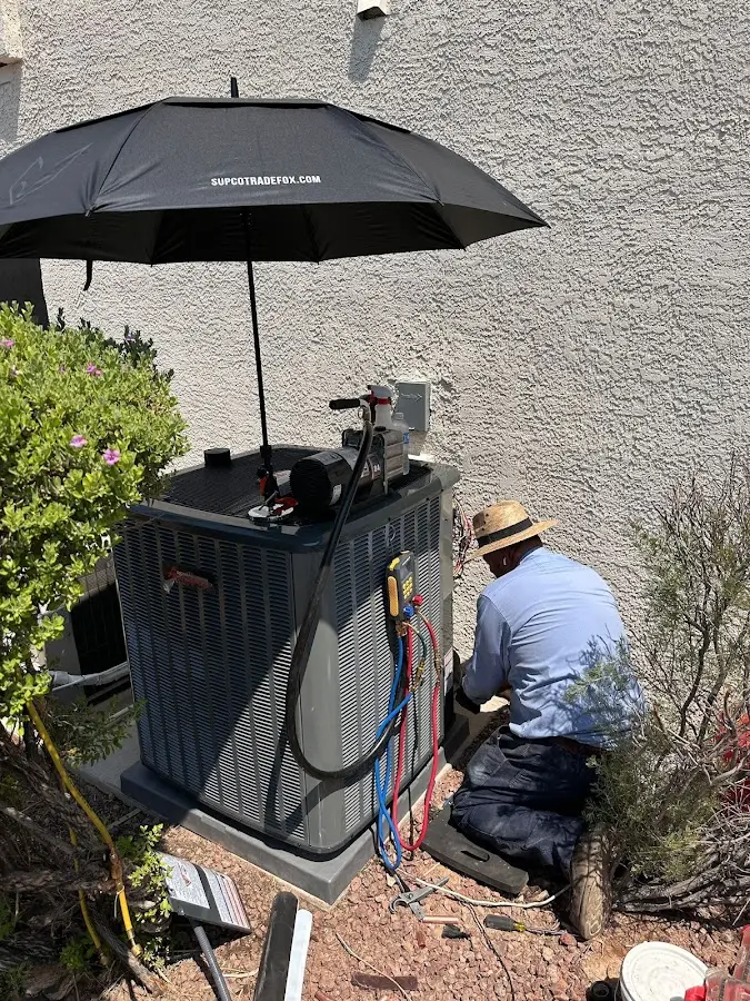 HVAC technician performing outdoor AC maintenance in Placentia